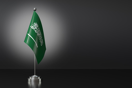 Small Kingdom of Saudi Arabia Flag in Front of Black Background, 3d Rendering