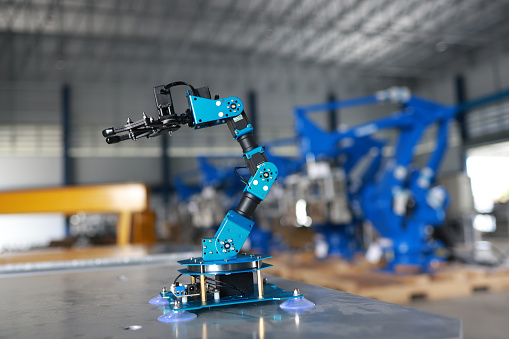 Robot arm mechanical hand artificial intelligence technology, mass production producing machinery industry, 3d model rendering modern futuristic concept.