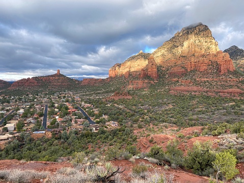 Beautiful views of the landscape and town view of Sedona, Arizona in winter, with Sedona surrounded by red-rock buttes, steep canyon walls and pine forests