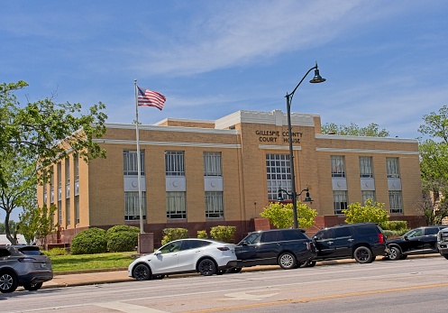 Fredericksburg, TX - USA, April 28, 2023. Gillespie county courthouse in Texas hill country of Fredericksburg, Texas.