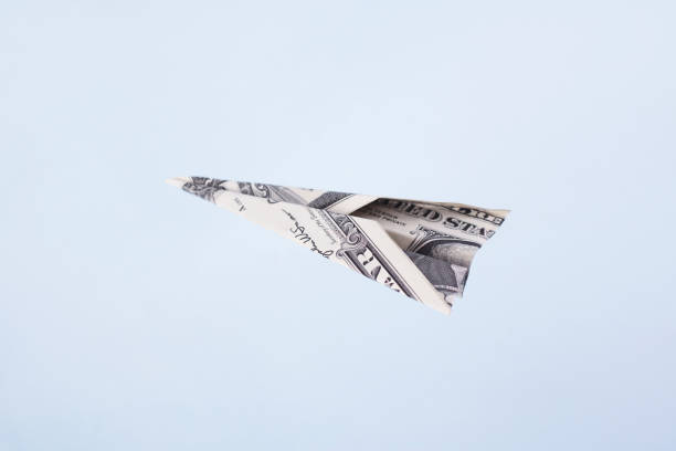 istock Paper airplane from the dollars 1993445059