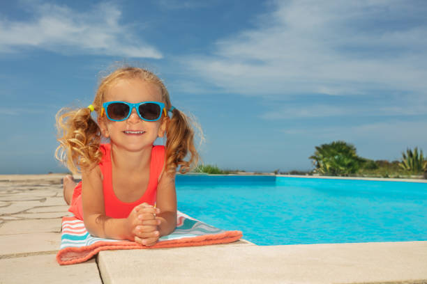 istock Smiling girl relaxing near pool day with sunglasses have fun 1993473802