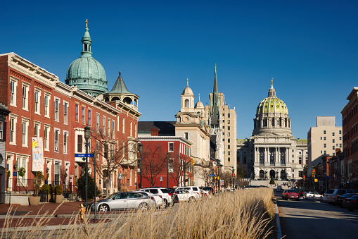 Downtown Harrisburg Pennsylvania USA on a sunny day, with the State Capitol Building in the background.