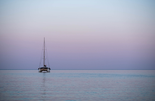 sailboat at sea at dusk