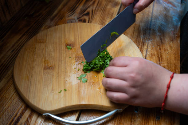 istock Chilean Pebre sauce preparation, chopping coriander 1993640492
