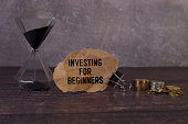 INVESTING FOR BEGINNERS . text on white paper on gray background