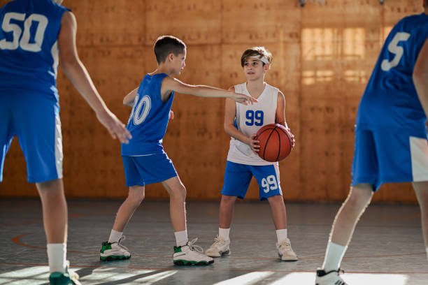 istock Junior basketball players in action practicing basket on training. 1993697651