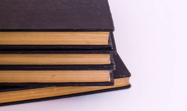 istock Close-up taken old,hard cover books stacked on white surface 1993702303