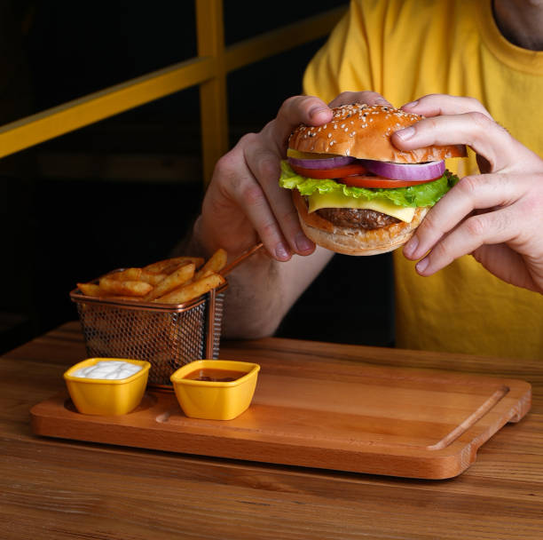 istock A man is about to eat a hamburger 1993717199