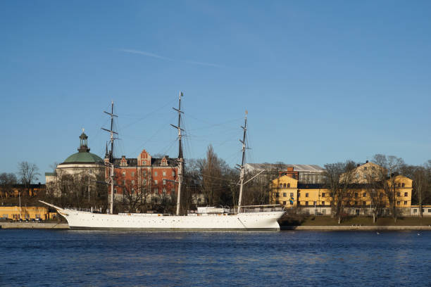 istock View of ship and buildings by river against clear blue sky 1993729407