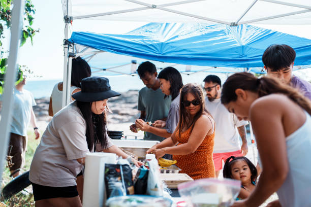 Multiracial group of friends having a bbq at the beach