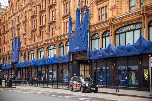 London, United Kingdom - February 07, 2024: Harrods department store in Knightsbridge covered in blue cloth for Burberry