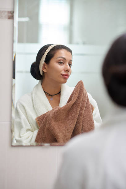 istock Young brunette woman in front of mirror 1993872469