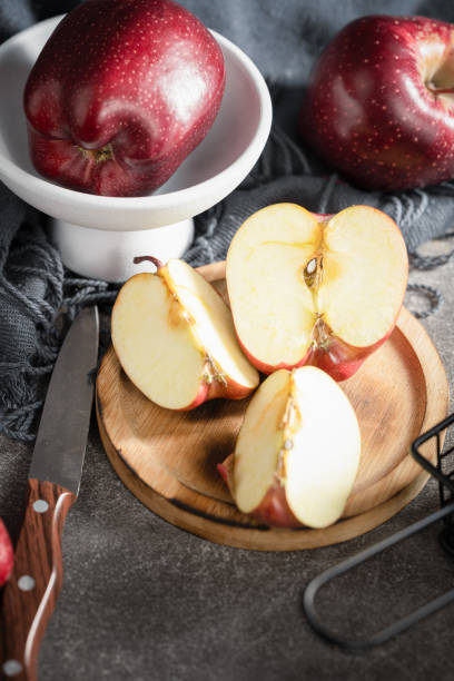 istock red apples on wooden background 1993951461