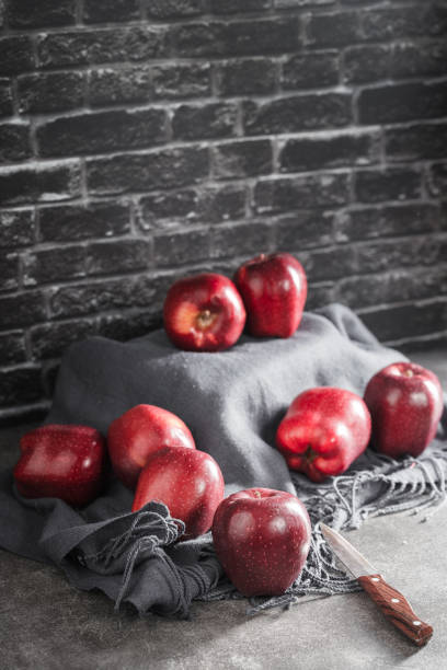 red apples on wooden background