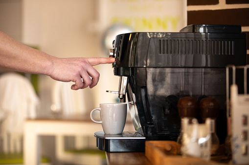 Preparing  a coffee cup from an espresso machine at home