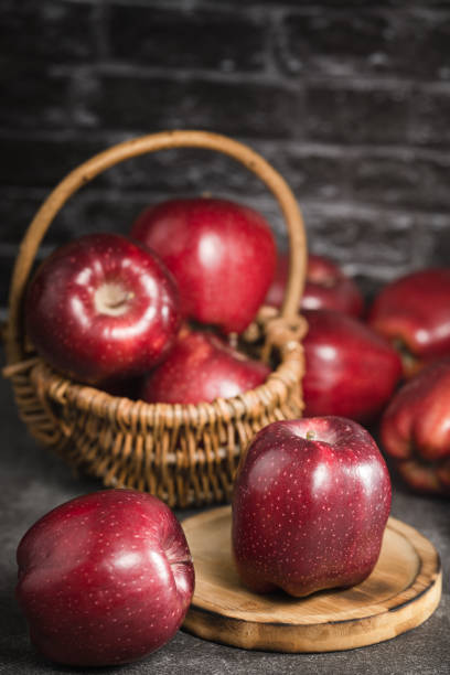 red apples on wooden background