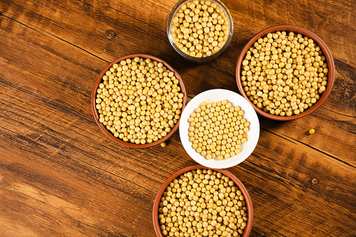 Gluten free cereals. Rice, buckwheat, corn groats, quinoa and millet in wooden bowls. Top view flat lay with copy space