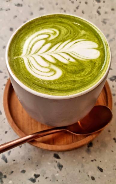 istock Matcha green tea with Latte art in a grey cup 1993984037