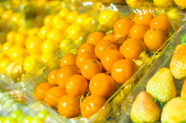 Cape gooseberries in plastic boxes on a fruit stand at Chiang Mai Province, Thailand.