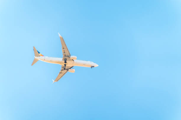 istock Airplane before landing in blue sky, Boeing 737-800 1994105244