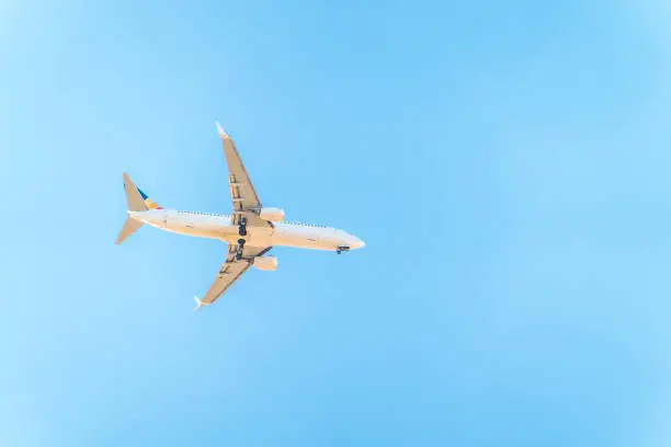 Airplane before landing in blue sky, Boeing 737-800. Air Transport. Tourism and travel concept.