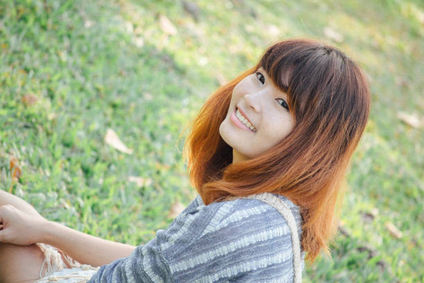 cute southeast asian woman in a park
