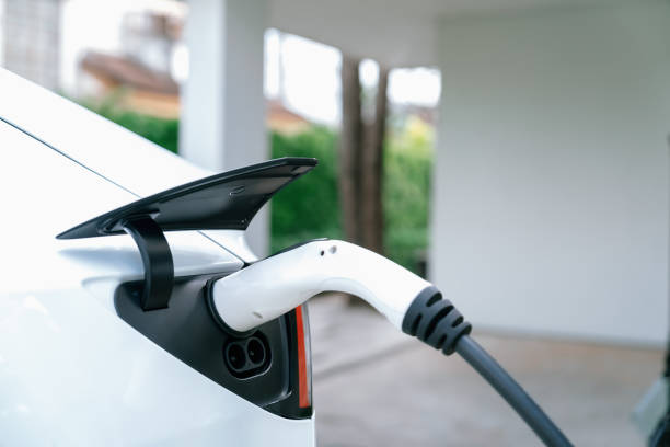 istock Electric vehicle technology utilized to home charging station. Synchronos 1994342179