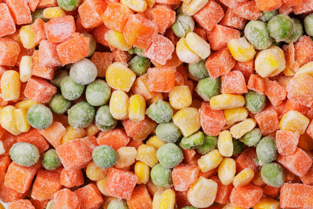 istock Close up of frozen mixed vegetables including Corn,  Peas, and Carrots 1994381932