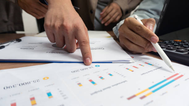 istock Creative idea teamwork concept. Group of multiethnic diverse team, business partner, project meeting at modern office. Businessman Point to a darts aiming at the target center business. 1994385525