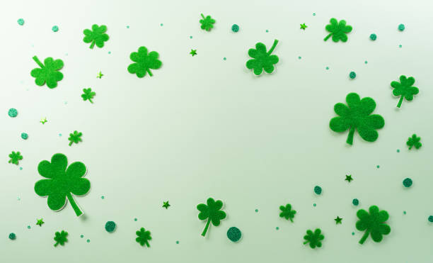 istock Happy St Patrick's Day decoration concept made from shamrocks ( clover leaf) on green pastel background. 1994406176
