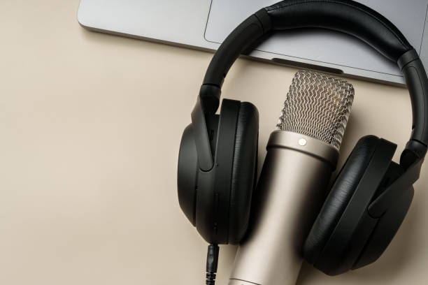 istock Headphones and microphone on the table close up 1994414036