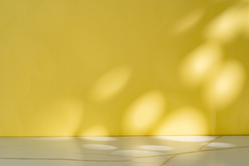 Abstract shadow from the window on yellow background wall