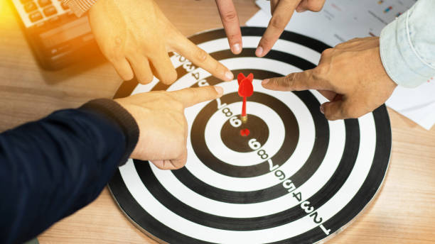 istock Businessman Point to a darts aiming at the target center business.Creative idea teamwork concept. Group of multiethnic diverse team, business partner, project meeting at modern office. 1994423977