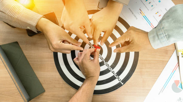 istock Businessman Point to a darts aiming at the target center business.Creative idea teamwork concept. Group of multiethnic diverse team, business partner, project meeting at modern office. 1994423991