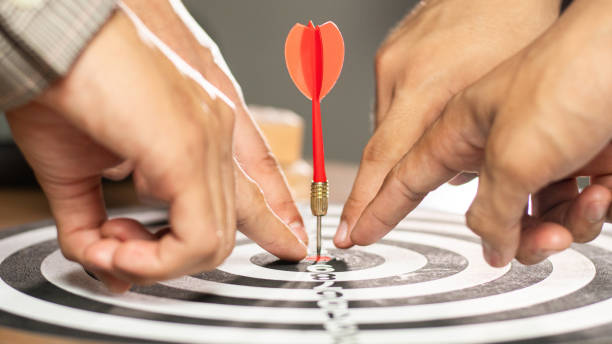 istock Businessman Point to a darts aiming at the target center business.Creative idea teamwork concept. Group of multiethnic diverse team, business partner, project meeting at modern office. 1994424006