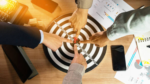 istock Businessman Point to a darts aiming at the target center business.Creative idea teamwork concept. Group of multiethnic diverse team, business partner, project meeting at modern office. 1994424011