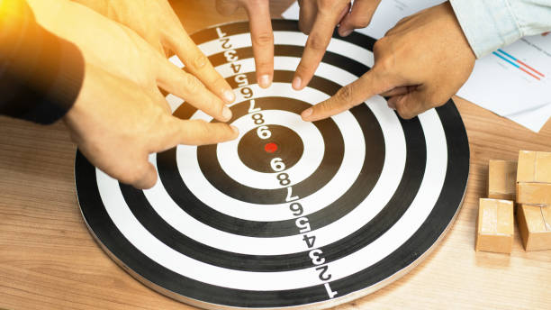 istock Businessman Point to a darts aiming at the target center business.Creative idea teamwork concept. Group of multiethnic diverse team, business partner, project meeting at modern office. 1994424530