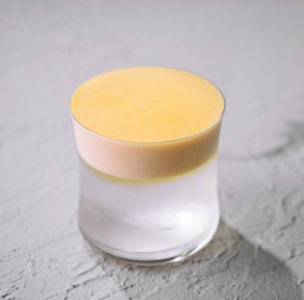 istock Elegant coconut cocktail glass with yellow foam 1994426627