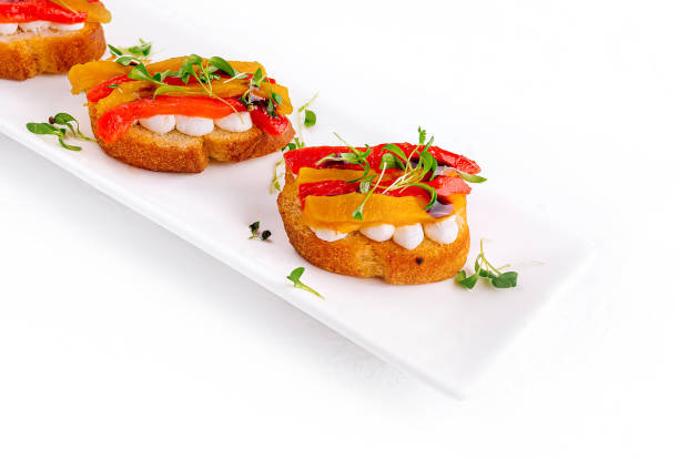 bruschetta with mozzarella and bell pepper - antipasto roasted pepper bell pepper pepper - fotografias e filmes do acervo