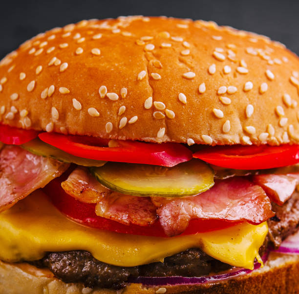 Bacon burger with beef patty close up
