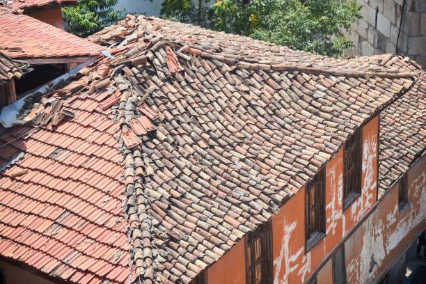 istock An old crumbling house. The ruined tiled roof. 1994467815