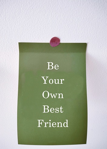 Green paper stick on wall background with text written BE YOUR OWN BEST FRIEND, concept of make peace and be kind to yourself, the only friend to have for life, guide yourself to greatness with self-compassion