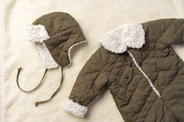 istock Gray quilted baby overalls for winter flat lay 1994477251