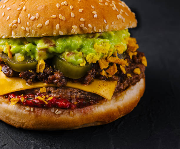 istock veggie burger with guacamole and pickles on toasted bun 1994497767