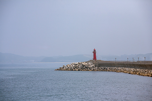 sea ​​with red lighthouse