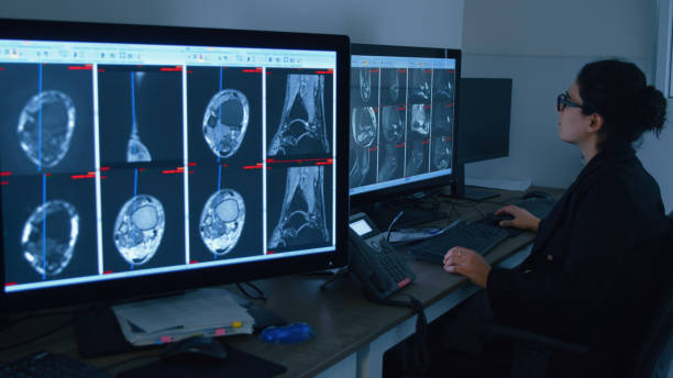 istock Radiologist analysis of MRI images on computer monitors 1994535629
