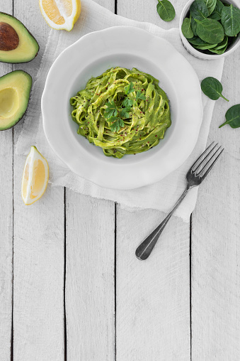 Tagliatelle pasta with avocado and spinach