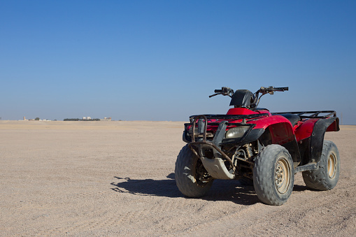 Quad bike for sand racing during safari through the desert of Egypt. Extreme vacation concept in the desert