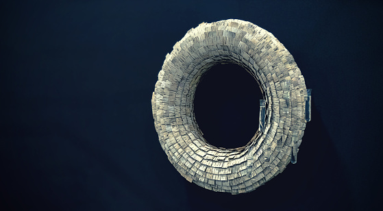 A circular decoration made from pieces of bark hangs on the wall